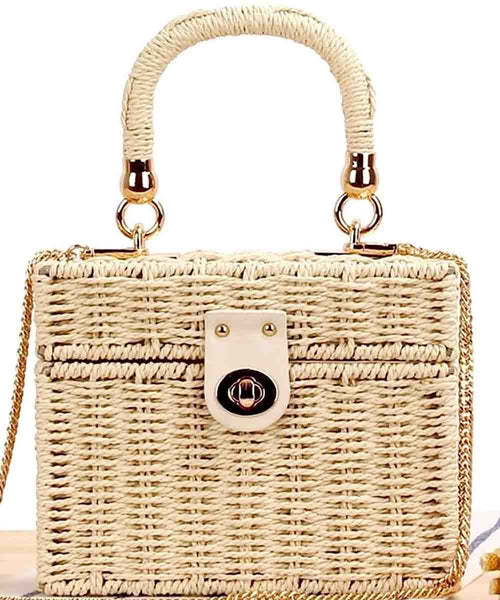 Woven handbag with a gold handle and chain strap on a white background