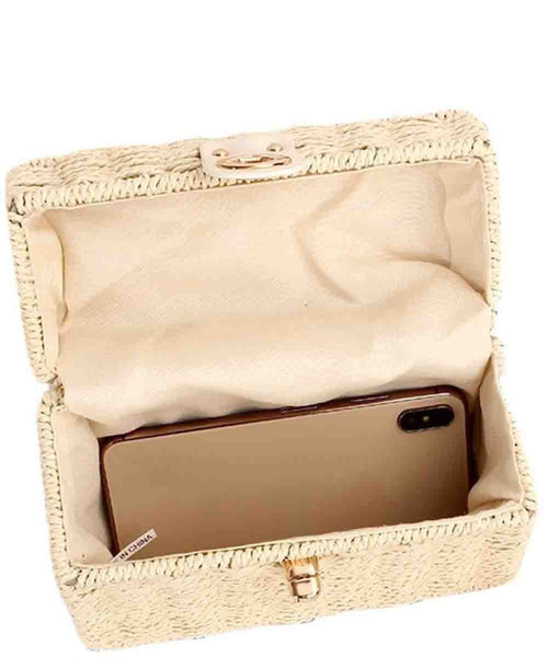 Beige woven clutch with a phone inside on a white background