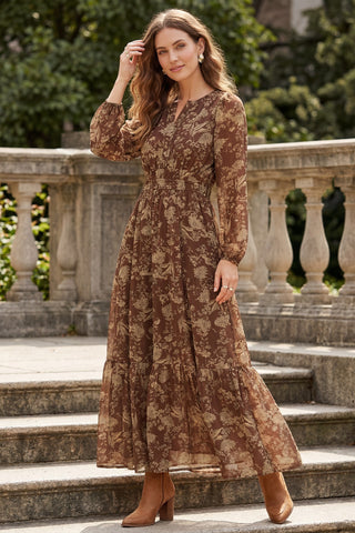 Woman wearing a long earthy brown floral maxi dress with pockets on an outdoor background