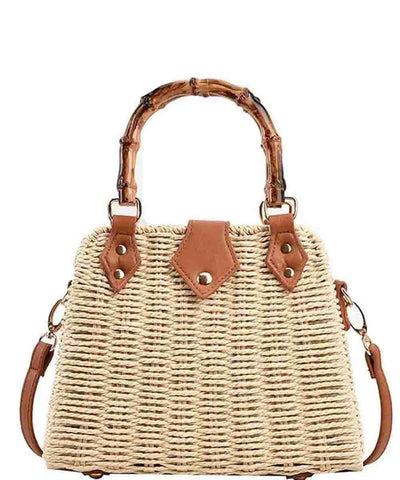 Woven handbag with bamboo handle and brown leather accents on a white background