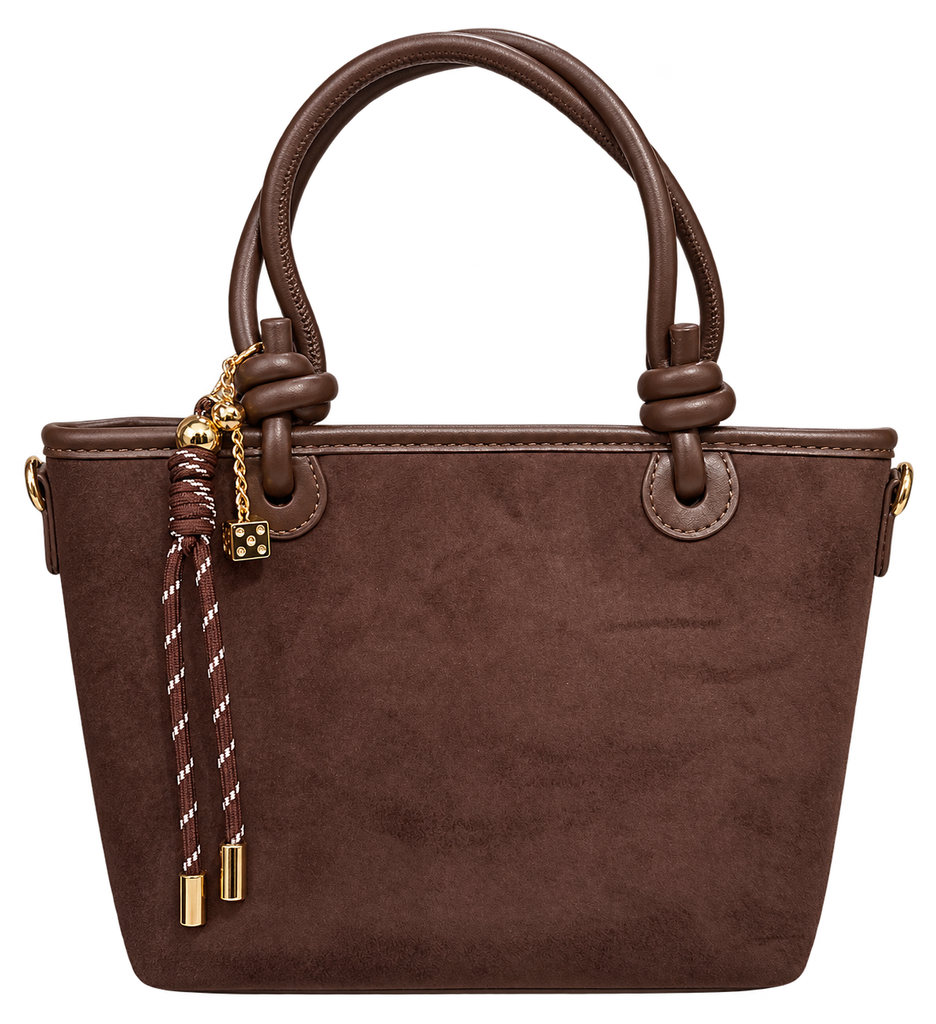 Chocolate brown structured tote bag with rounded double handles, gold-tone hardware, and a decorative braided tassel charm, shown against a white background.
