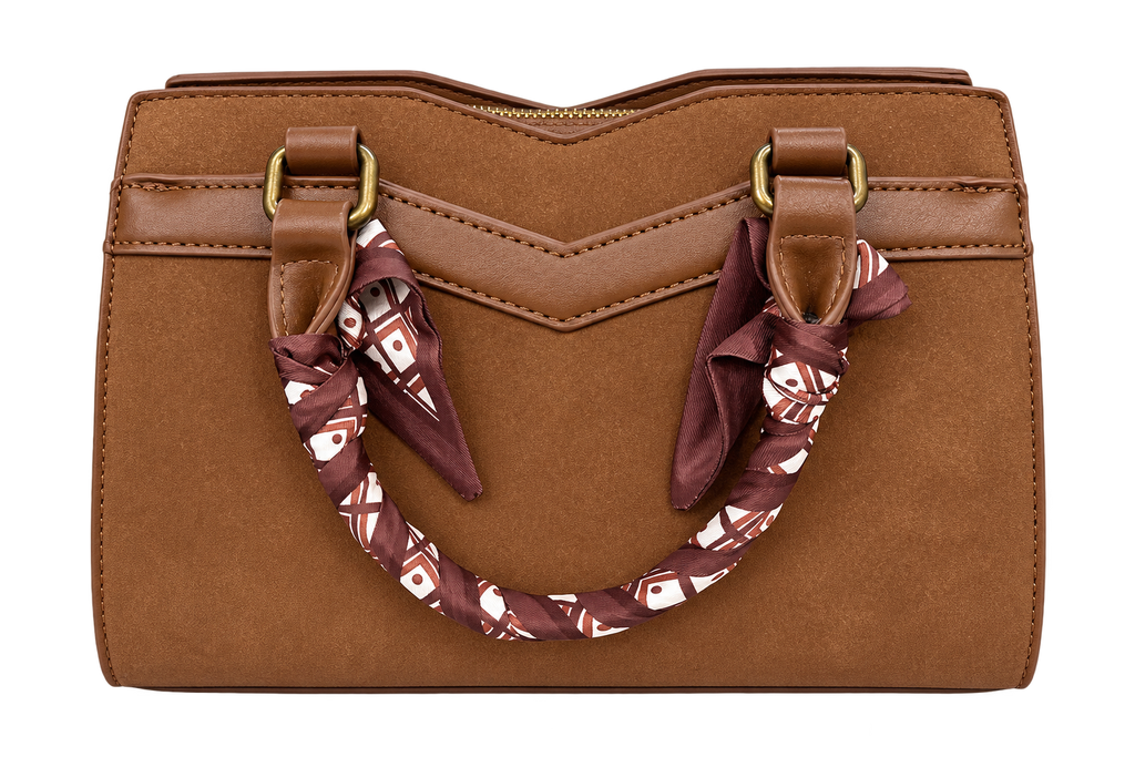 **Alt Text:** Brown structured handbag with double handles, gold-tone hardware, and decorative patterned scarf-wrapped handles, featuring a zippered top and stitched detailing against a white background.